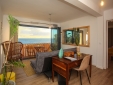 living room with balcony, sea view